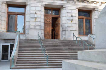 All visitor may use the front entrance on the east side. People with mobility issues or strollers should use the lower level doors on the west side.